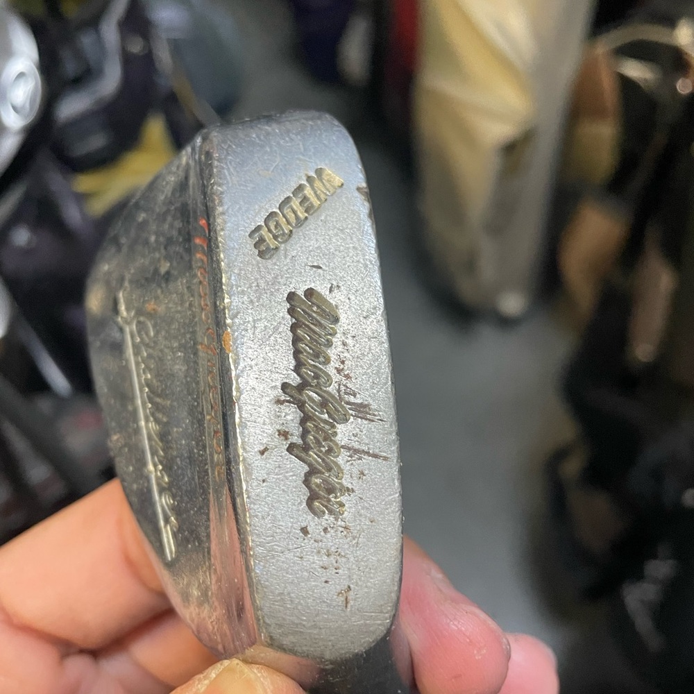 Mac Gregor challenger golf wedge in right hand 
Used